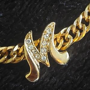 Gold tone monogram bracelet